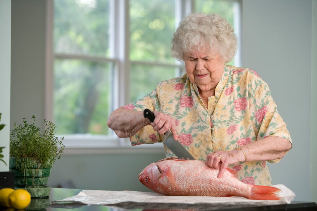 Jean cutting up a fish